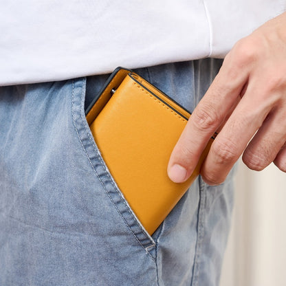 A Minimalist Tri-Fold Wallet in Black, Featuring a Business Style, Ultra-Thin Foldable Design, Secure Card Slots, And a Snap Closure